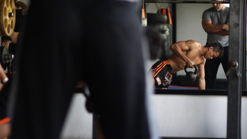 man in black and orange shorts