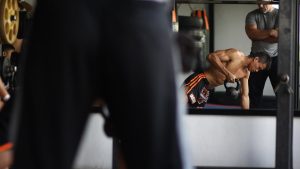 man in black and orange shorts